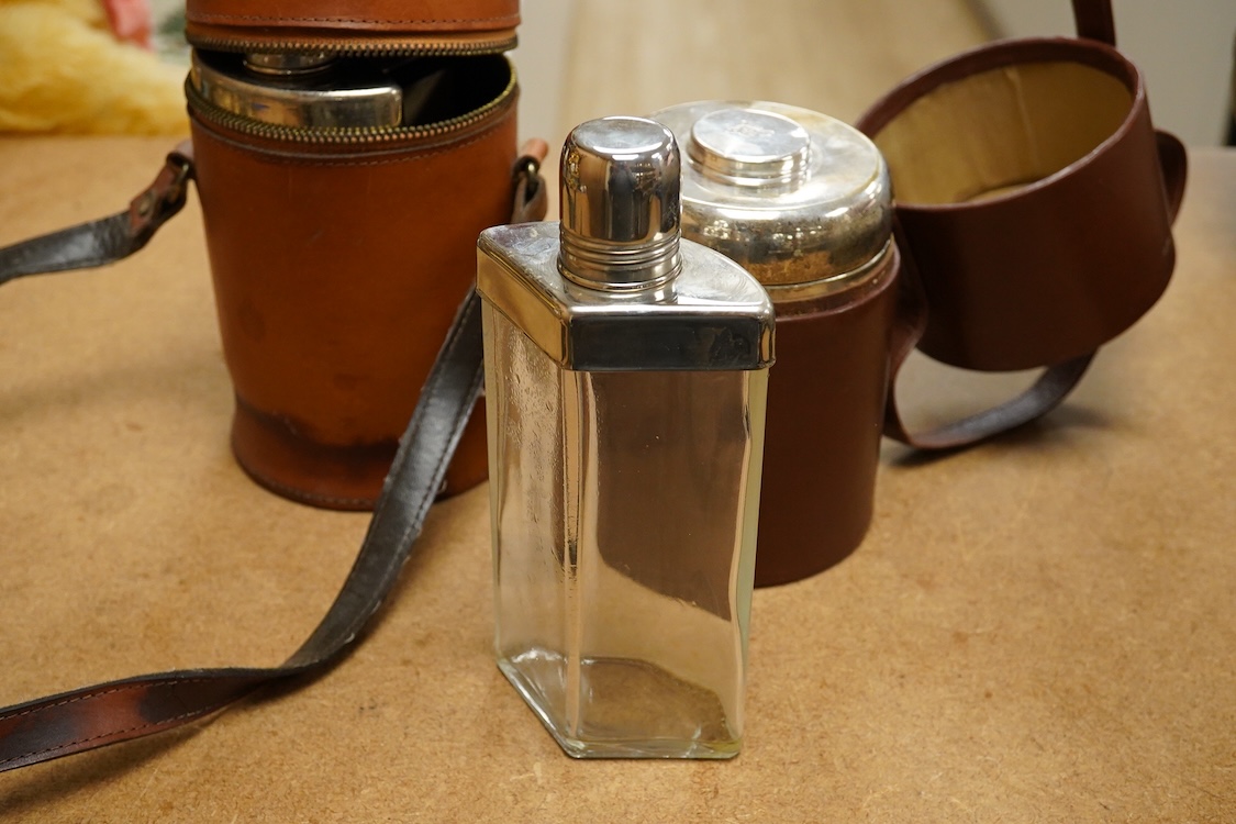 Two silver plate mounted flasks in cases to include a three sectioned example, largest 19cm high